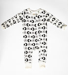 One-piece zip-up sleeper with a peaceful moon and star print, designed for warmth without overheating.