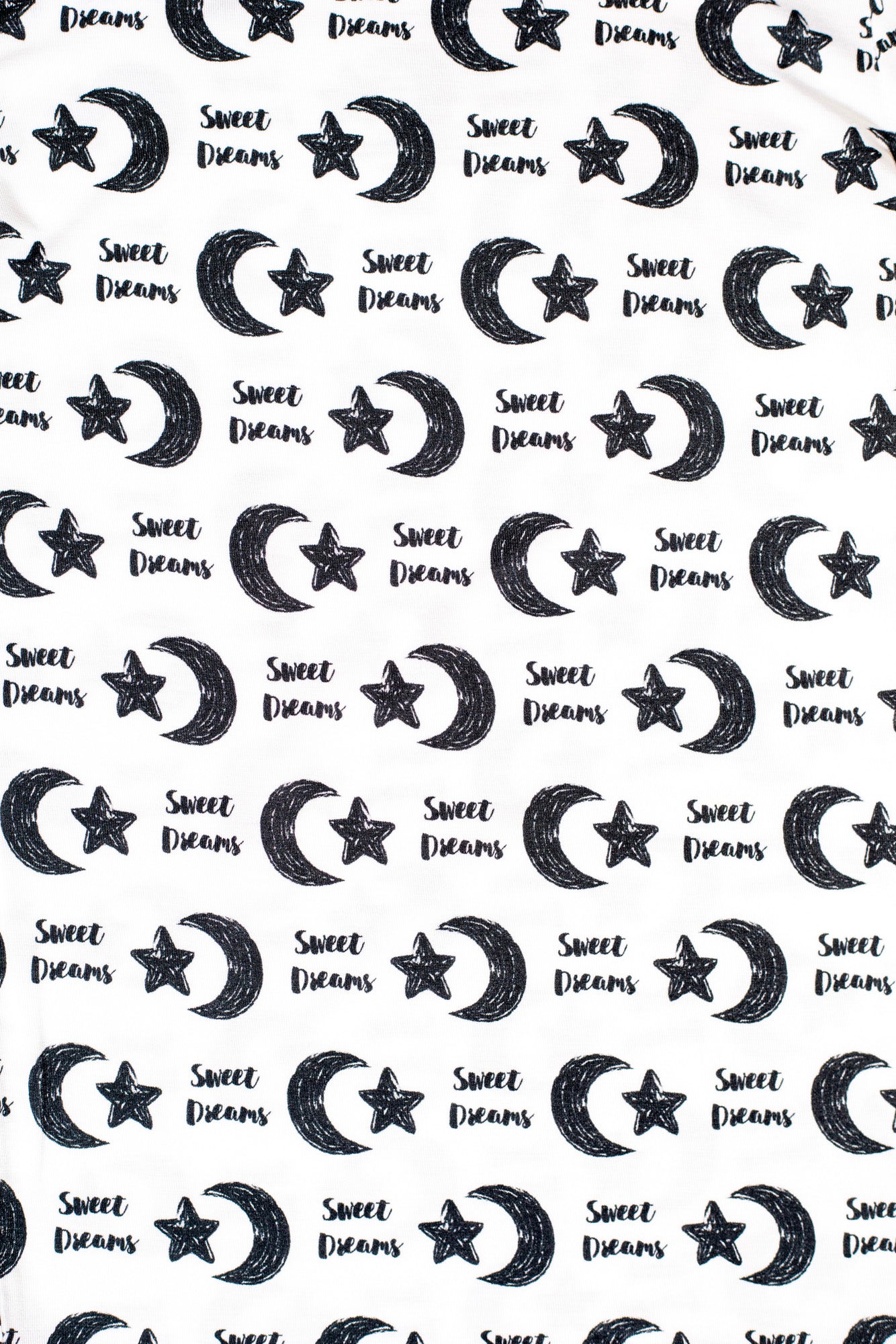Earthly Threads kids’ bamboo pajamas designed for comfort with a gentle, celestial print featuring moons, stars, and "Sweet Dreams".