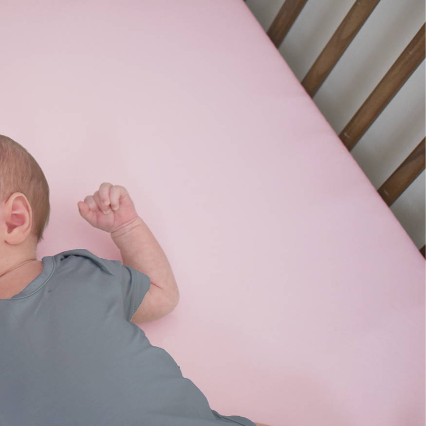 Earthly Threads Organic Bamboo Crib Sheet in soft pink, made for delicate skin and eczema-prone babies. Made from 100% certified organic bamboo.