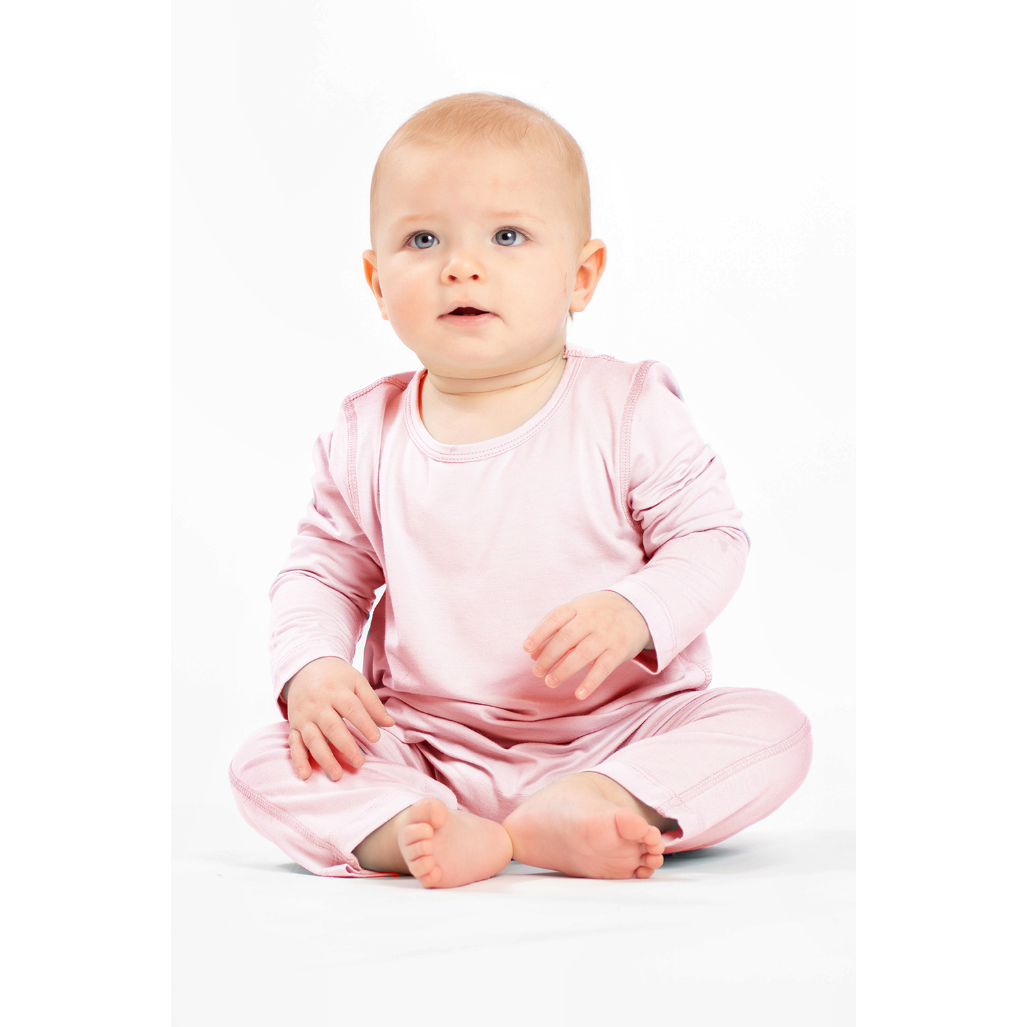Pink bamboo snap romper crafted for comfort, convenience, and eco-conscious families.
