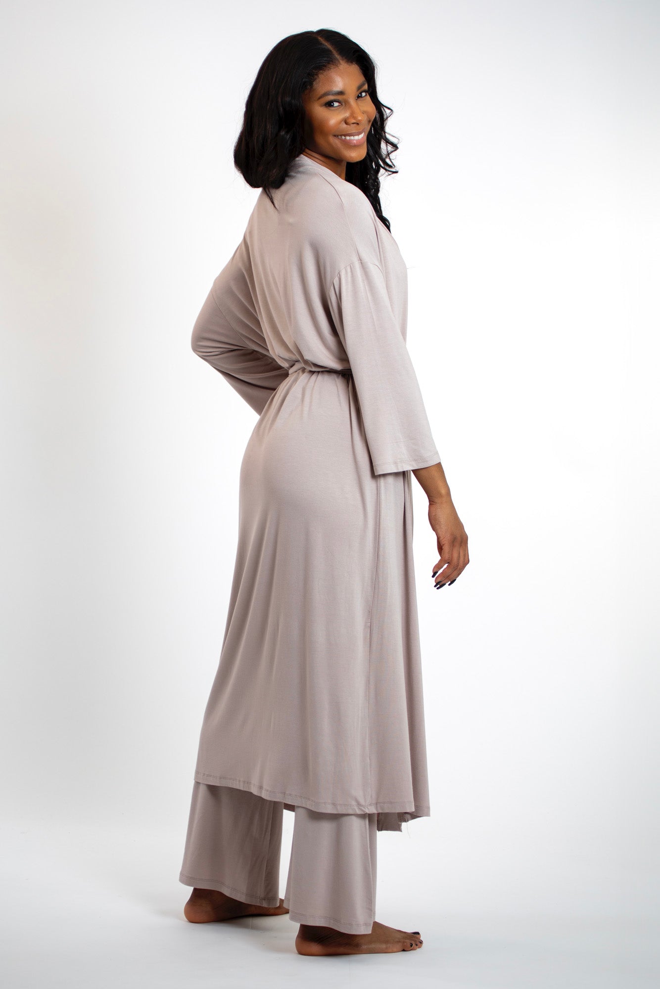 Stylish yet functional bamboo robe, offering the perfect blend of comfort and sophistication for lounging or layering.